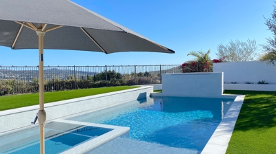 Pool on sunny day with umbrella Photo